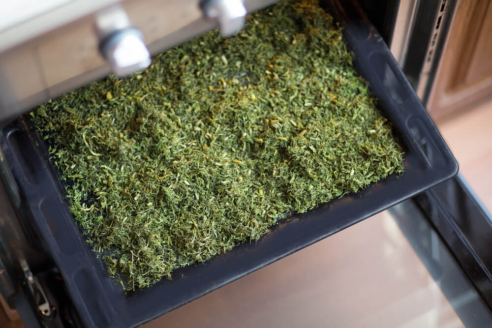 Drying some lovely fennel herbs on a cookie sheet or baking sheet next to the oven.