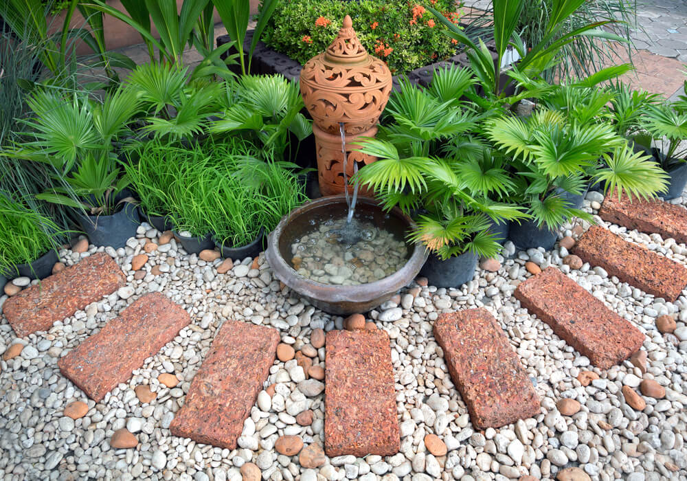 Corner garden with lovely rocks and fancy stones.