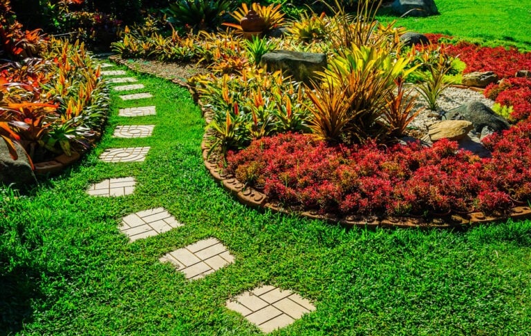 Gorgeous garden landscape design with fancy pathway and many shrubs.
