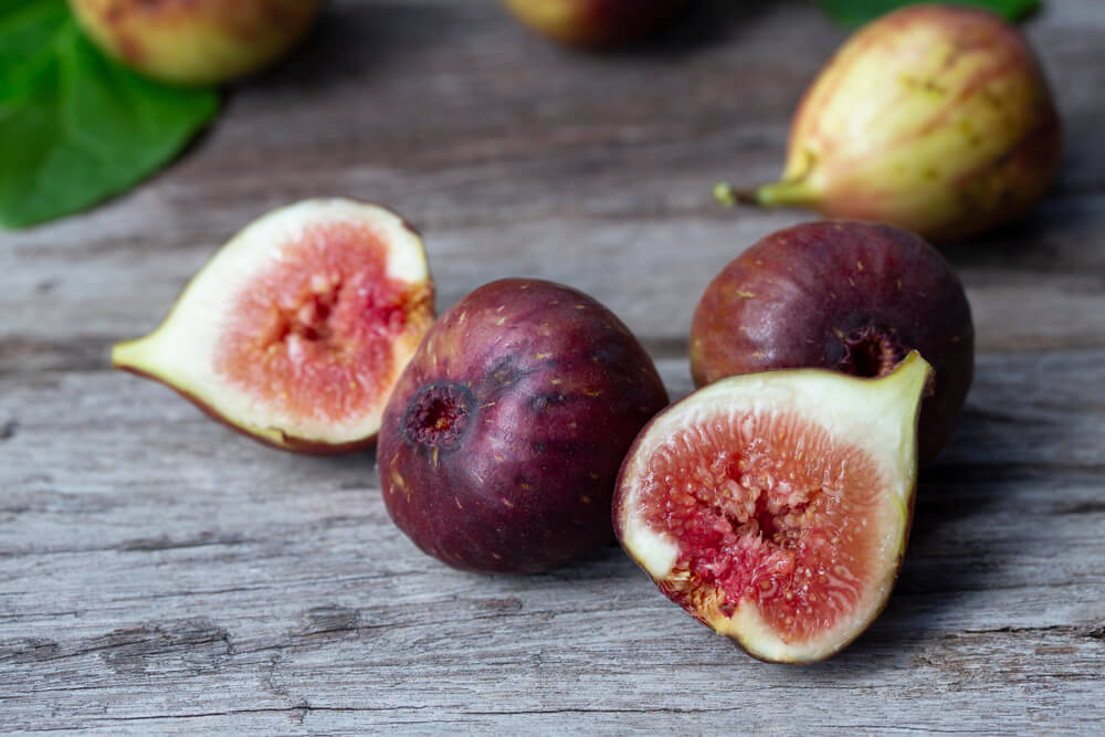 Delicious brown turkey fig sitting on a wooden table.