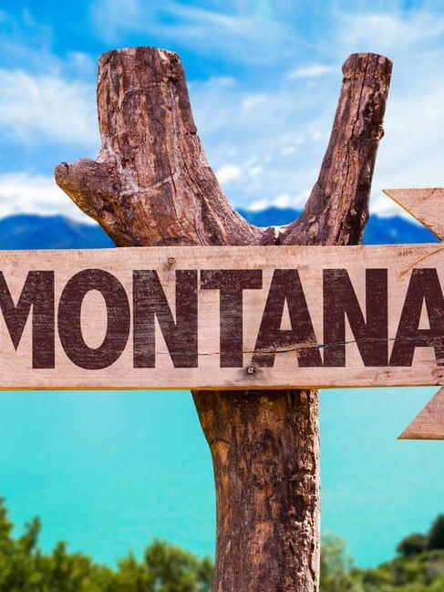 welcome to montana sign in the beautiful wilderness