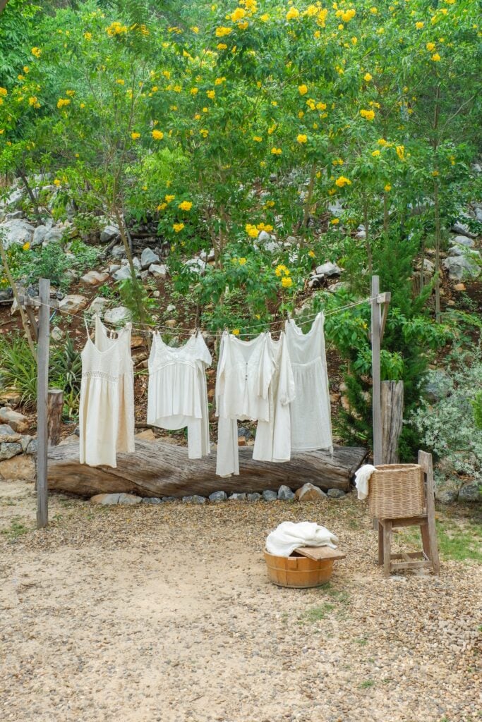 Different clothes drying on laundry line against garden background,clothes hanging laundry on washing line for drying towels drying on the clothesline.