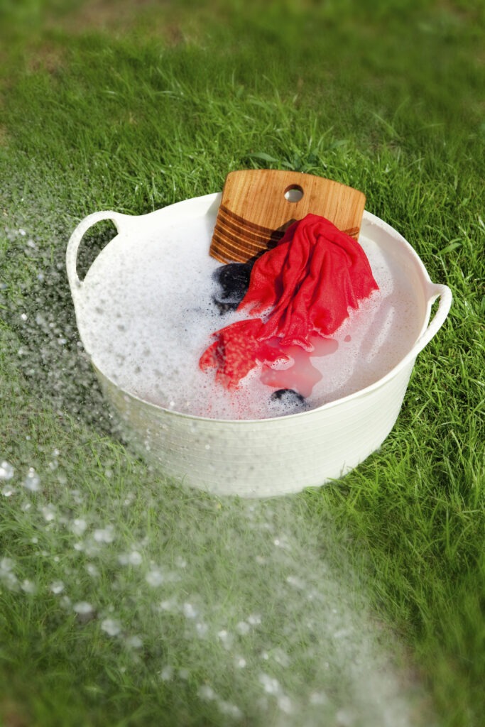 Tub full of water with clothes for hand washing